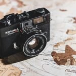 black Konica SLR camera on map