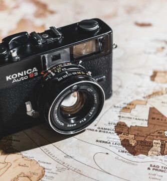 black Konica SLR camera on map