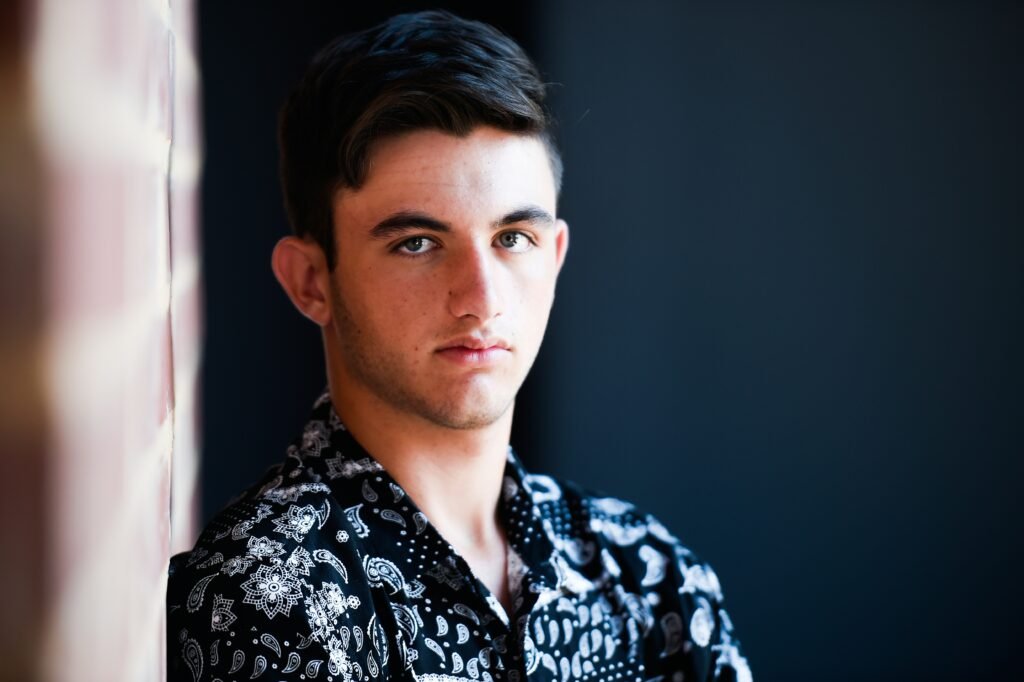 man in black and white floral collared shirt