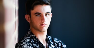 man in black and white floral collared shirt